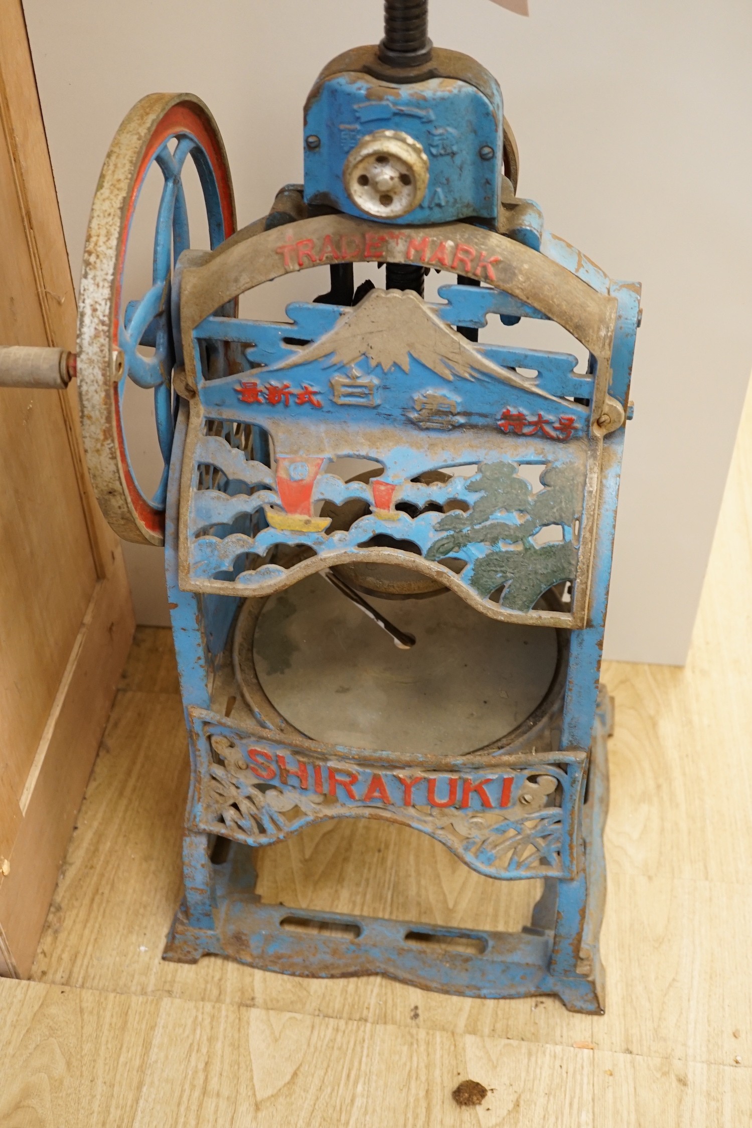 A vintage Japanese 'Shirauuki' painted cast iron ice shaver, 89cms high